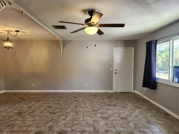 a kitchen with stainless steel appliances a stove microwave and refrigerator