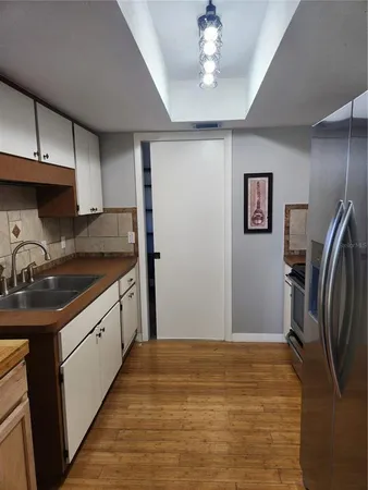 a bedroom with a bed and a potted plant