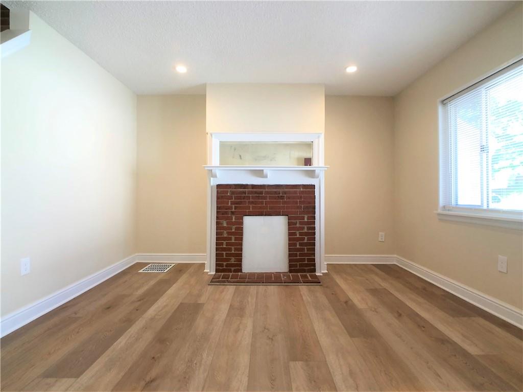 433 Augusta Street Pittsburgh, PA 15211 - Photo 3 of 21 an empty room with a fireplace
