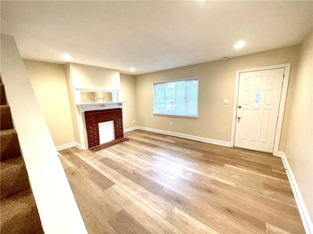 433 Augusta Street Pittsburgh, PA 15211 - Photo 4 of 21 a view of empty room with a fireplace