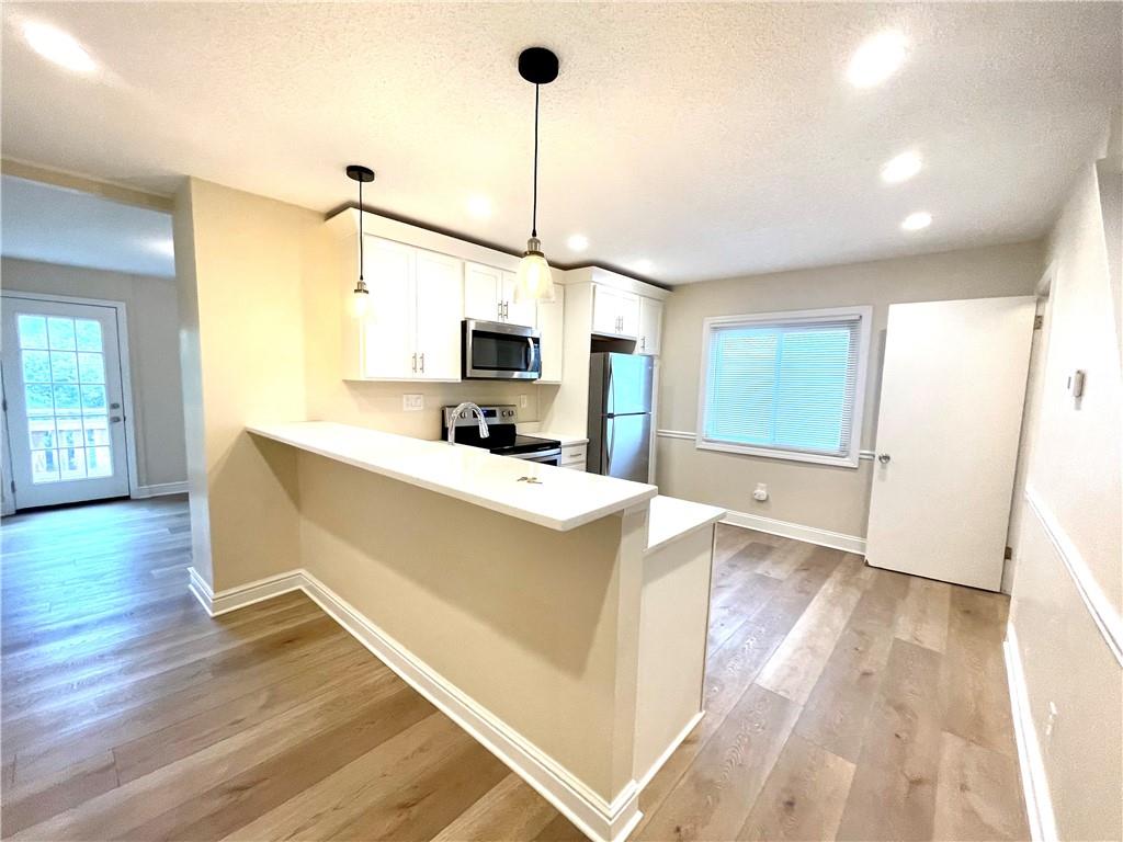 433 Augusta Street Pittsburgh, PA 15211 - Photo 6 of 21 a living room with furniture and a flat screen tv