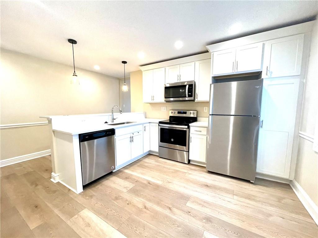 433 Augusta Street Pittsburgh, PA 15211 - Photo 7 of 21 a kitchen with a refrigerator stove and sink