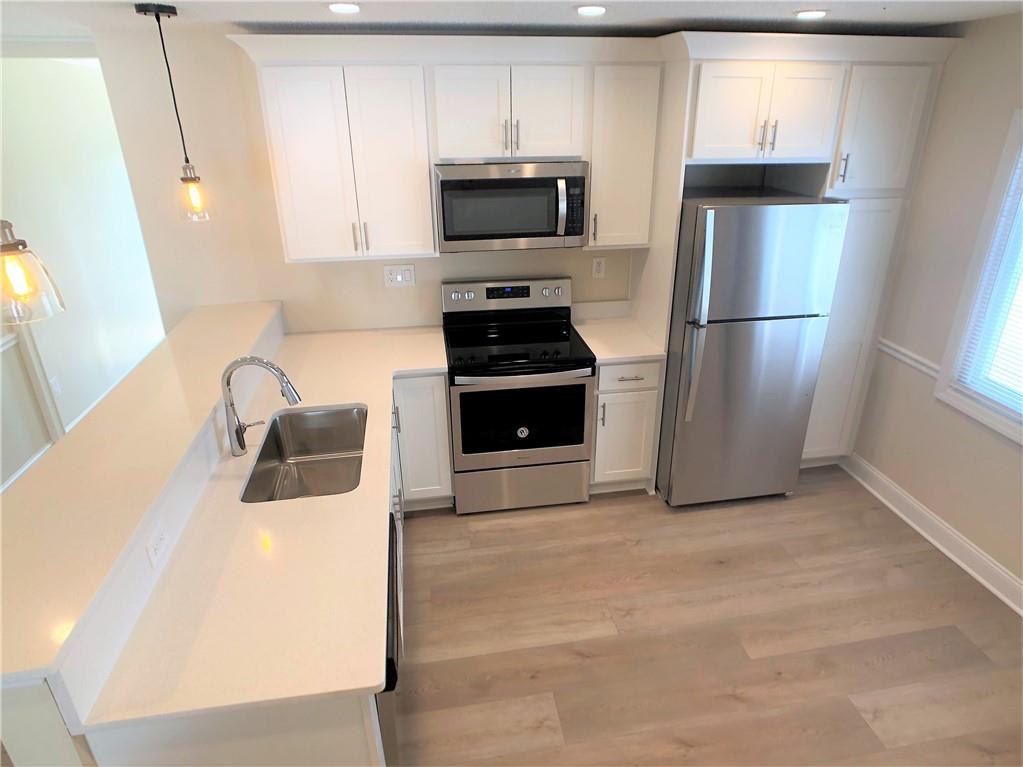 433 Augusta Street Pittsburgh, PA 15211 - Photo 8 of 21 a kitchen with a refrigerator and a stove