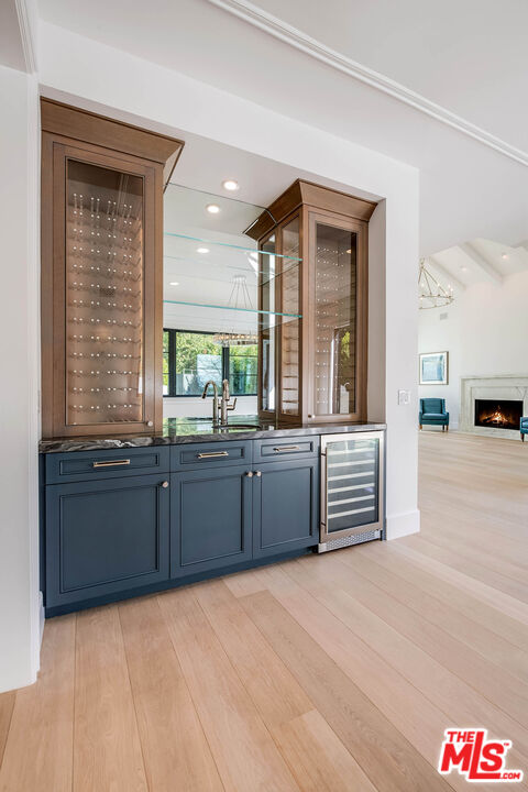 1348 Marinette Road Pacific Palisades, CA 90272 - Photo 11 of 50 a kitchen with granite countertop a sink and cabinets