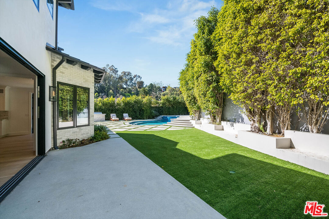 1348 Marinette Road Pacific Palisades, CA 90272 - Photo 19 of 50 a view of a house with a yard