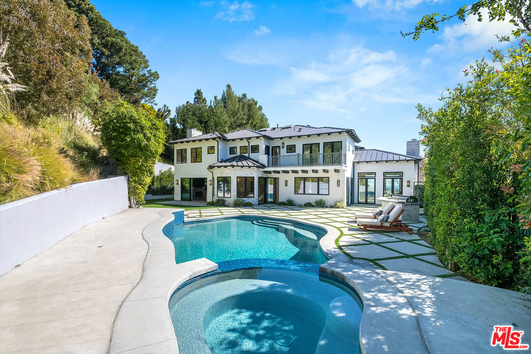 1348 Marinette Road Pacific Palisades, CA 90272 - Photo 21 of 50 a view of a house with swimming pool and sitting area