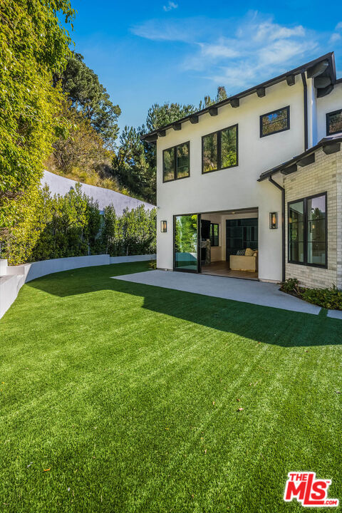 1348 Marinette Road Pacific Palisades, CA 90272 - Photo 22 of 50 a front view of a house with garden and porch
