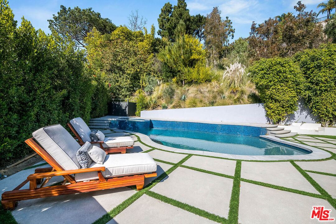 1348 Marinette Road Pacific Palisades, CA 90272 - Photo 24 of 50 a view of a patio with lawn chairs