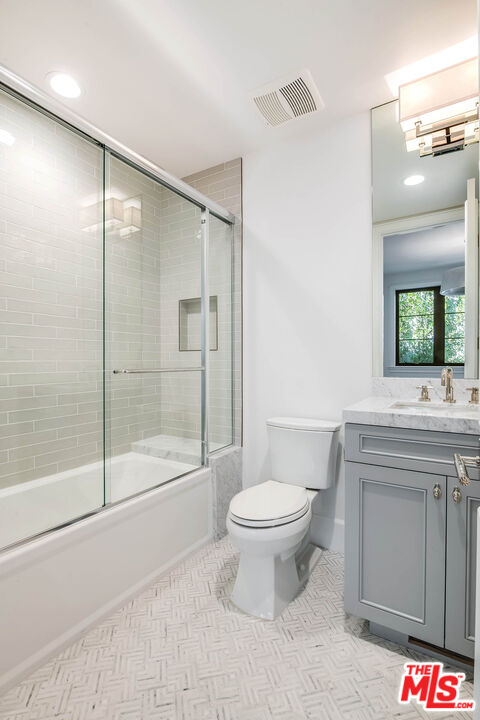 1348 Marinette Road Pacific Palisades, CA 90272 - Photo 28 of 50 a bathroom with a toilet a sink and shower