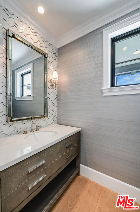 1348 Marinette Road Pacific Palisades, CA 90272 - Photo 29 of 50 a bathroom with a sink and a mirror