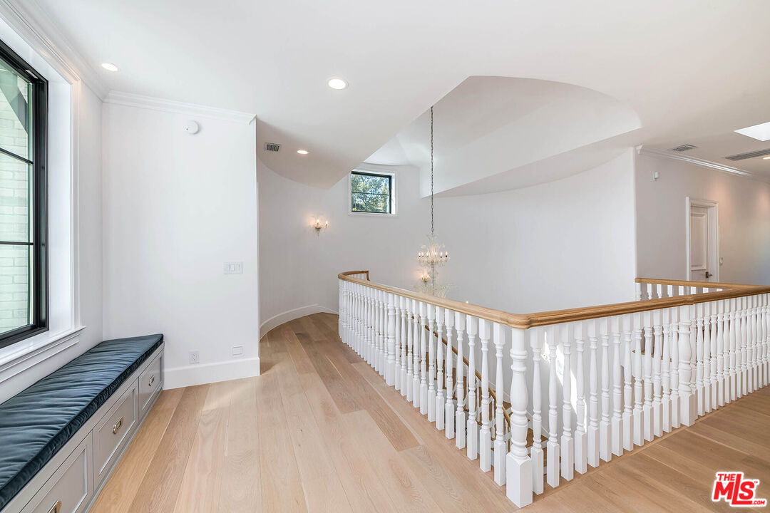 1348 Marinette Road Pacific Palisades, CA 90272 - Photo 31 of 50 a view of a hallway with wooden floor