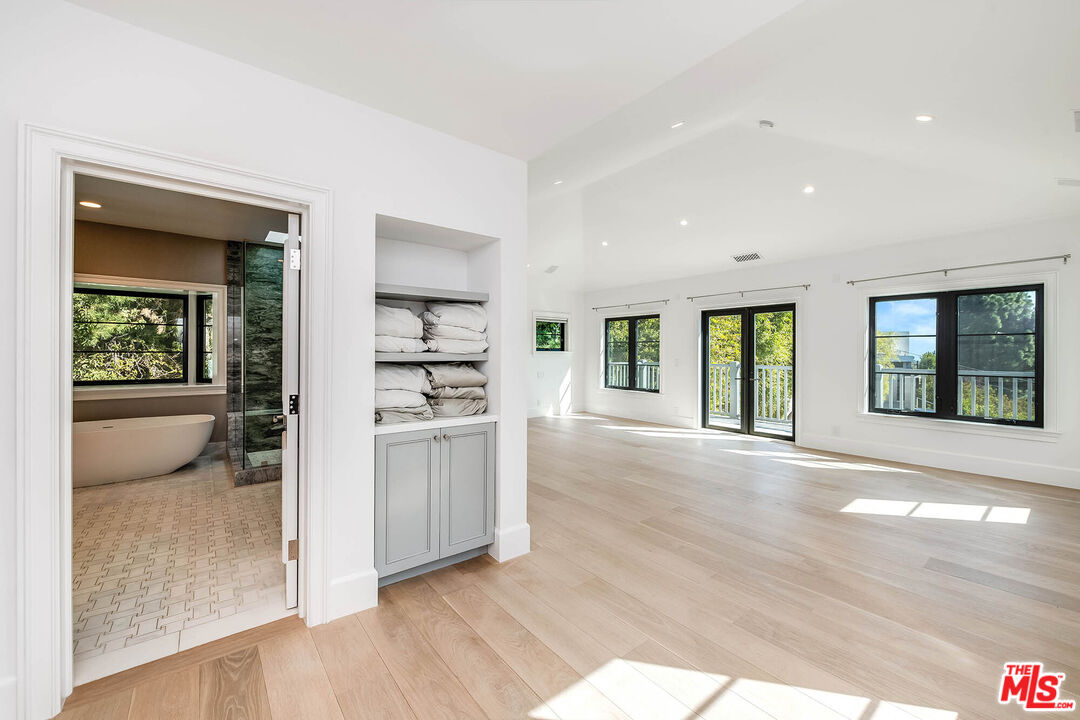 1348 Marinette Road Pacific Palisades, CA 90272 - Photo 32 of 50 a living room with stainless steel appliances kitchen island granite countertop a refrigerator and a stove