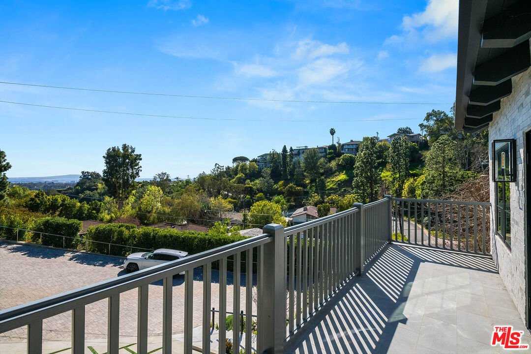 1348 Marinette Road Pacific Palisades, CA 90272 - Photo 34 of 50 a view of balcony with wooden floor and fence