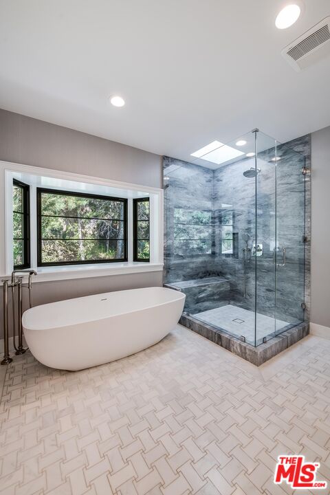 1348 Marinette Road Pacific Palisades, CA 90272 - Photo 37 of 50 a bathroom with a tub and window