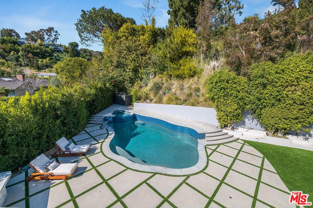 1348 Marinette Road Pacific Palisades, CA 90272 - Photo 42 of 50 an aerial view of a house having yard