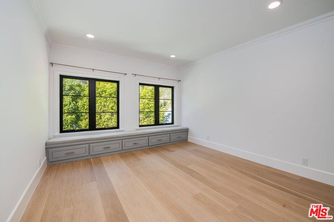 1348 Marinette Road Pacific Palisades, CA 90272 - Photo 43 of 50 wooden floor in an empty room with a window