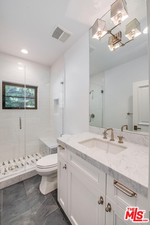 1348 Marinette Road Pacific Palisades, CA 90272 - Photo 44 of 50 a bathroom with a granite countertop sink and a mirror