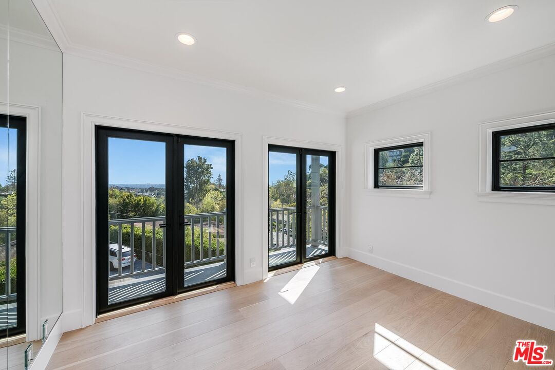 1348 Marinette Road Pacific Palisades, CA 90272 - Photo 48 of 50 a view of an empty room with glass door