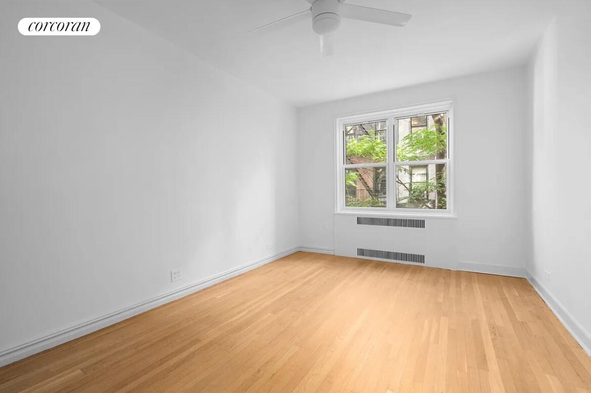 210 West 19th Street, Unit 4J Manhattan, NY 10011 - Photo 10 of 13 an empty room with a window