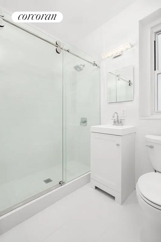 210 West 19th Street, Unit 4J Manhattan, NY 10011 - Photo 12 of 13 a bathroom with a sink a toilet and shower