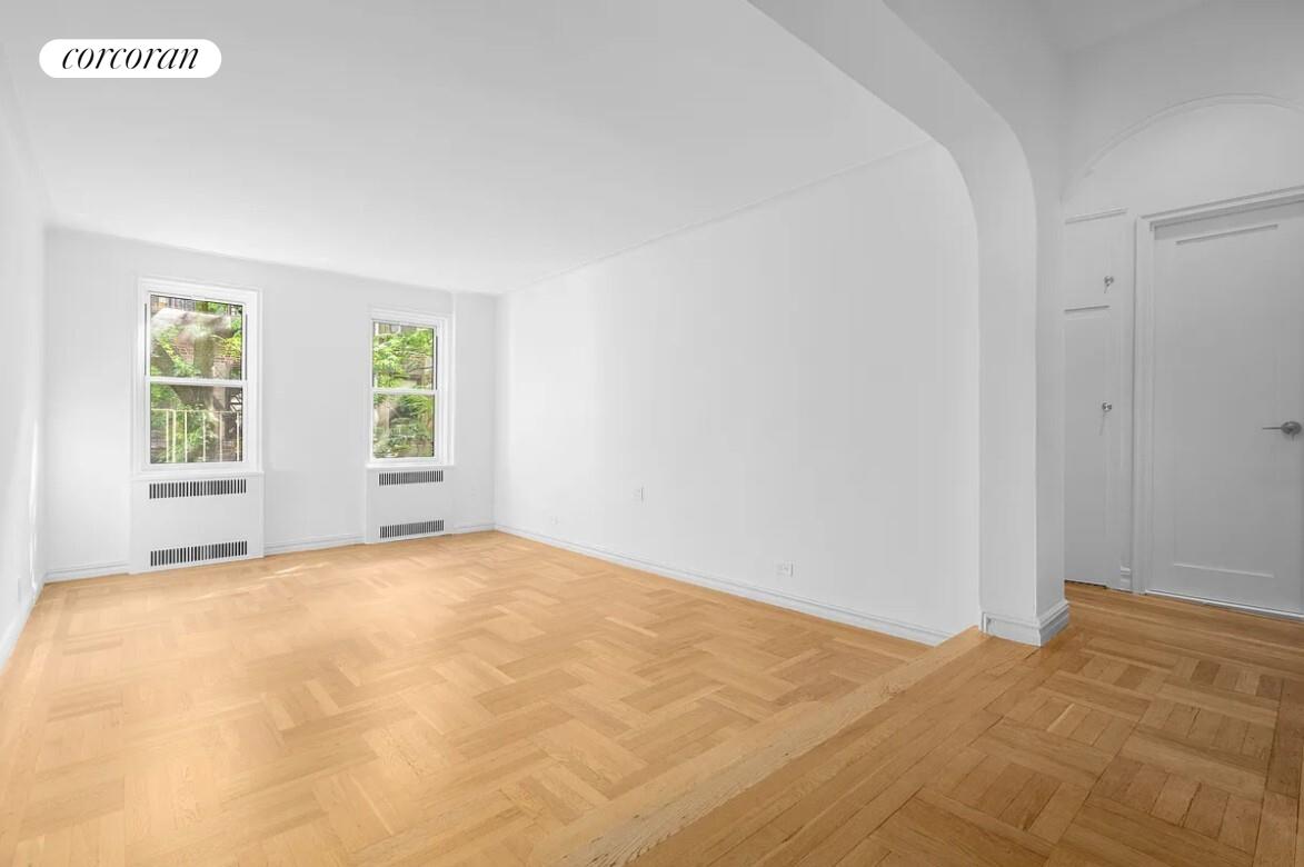 210 West 19th Street, Unit 4J Manhattan, NY 10011 - Photo 2 of 13 a view of an empty room with windows