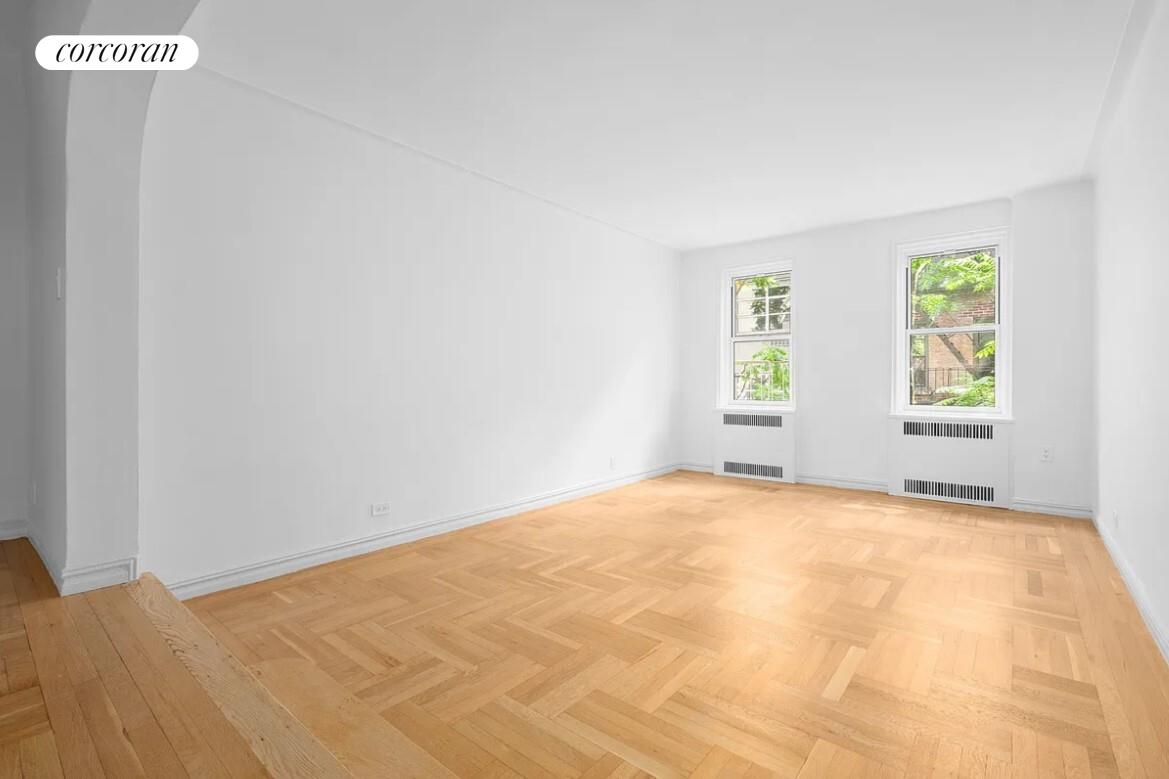 210 West 19th Street, Unit 4J Manhattan, NY 10011 - Photo 4 of 13 a view of an empty room with a window