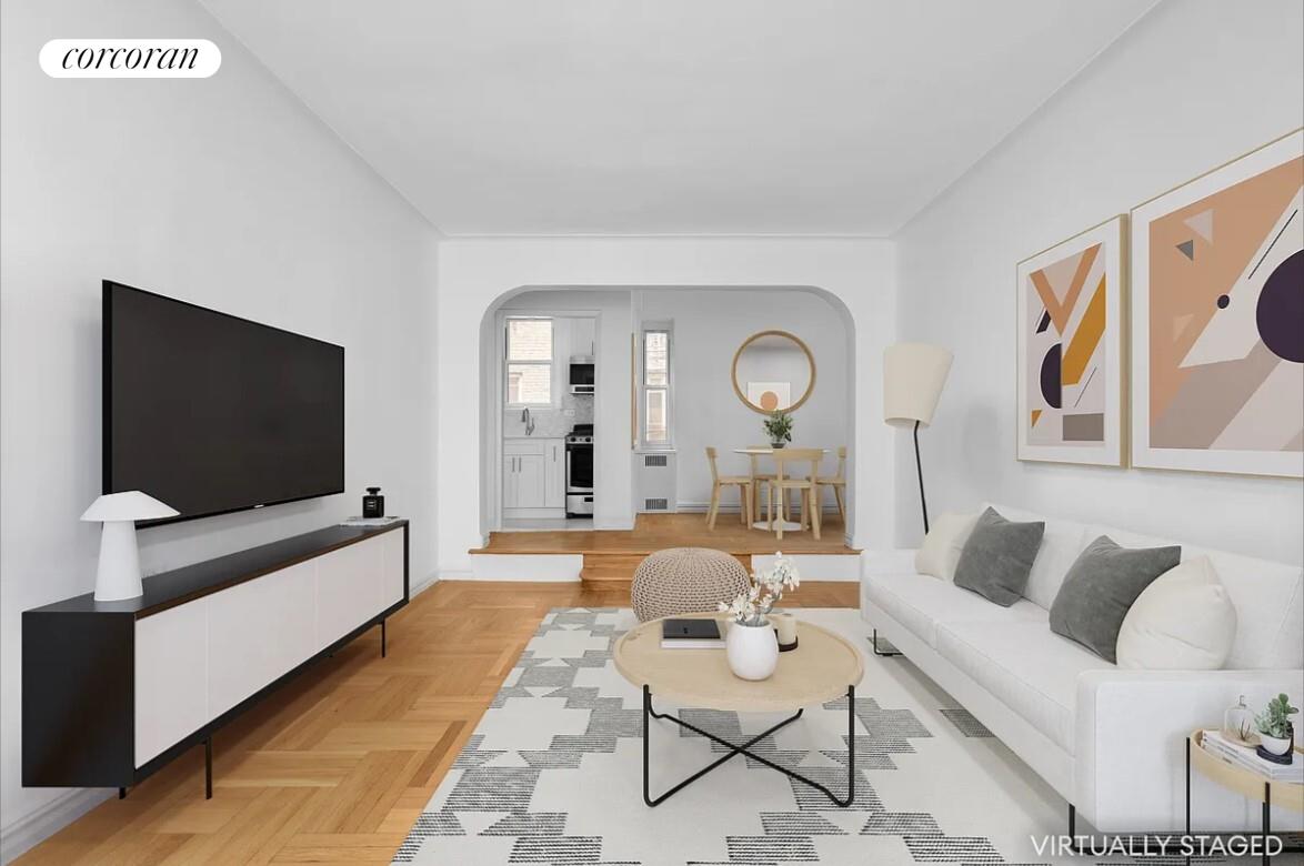 210 West 19th Street, Unit 4J Manhattan, NY 10011 - Photo 5 of 13 a living room with furniture and a flat screen tv