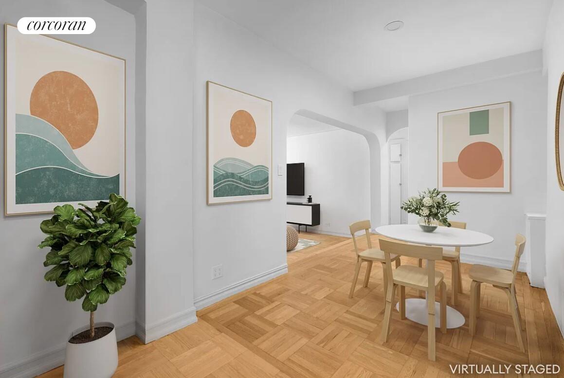210 West 19th Street, Unit 4J Manhattan, NY 10011 - Photo 7 of 13 a living room with furniture and a potted plant