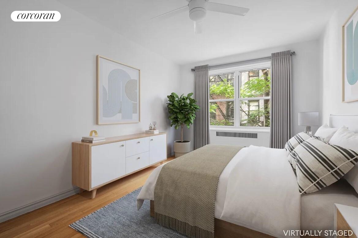 210 West 19th Street, Unit 4J Manhattan, NY 10011 - Photo 9 of 13 a spacious bedroom with a bed and a dresser