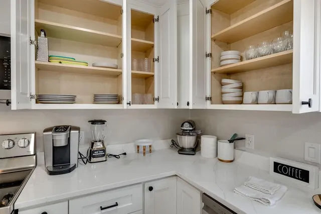 a kitchen with a sink and cabinets