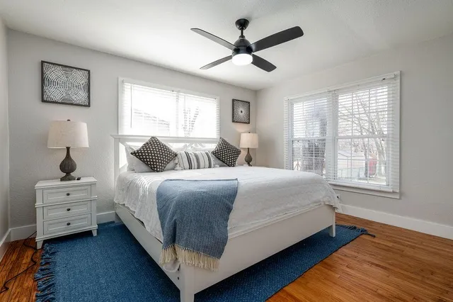 a bedroom with a bed and window