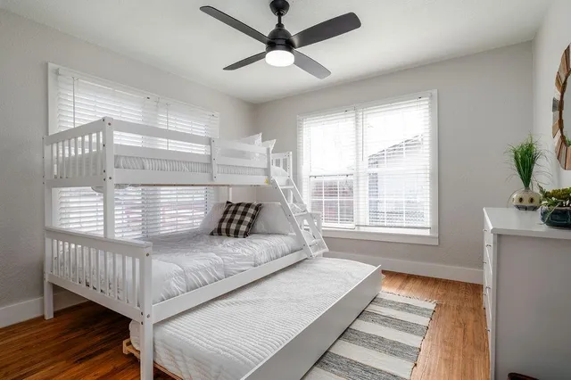 a living room with a bed furniture and a window