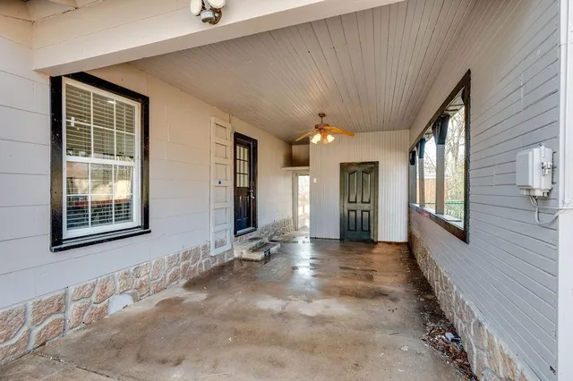 a view of an entryway with wooden floor