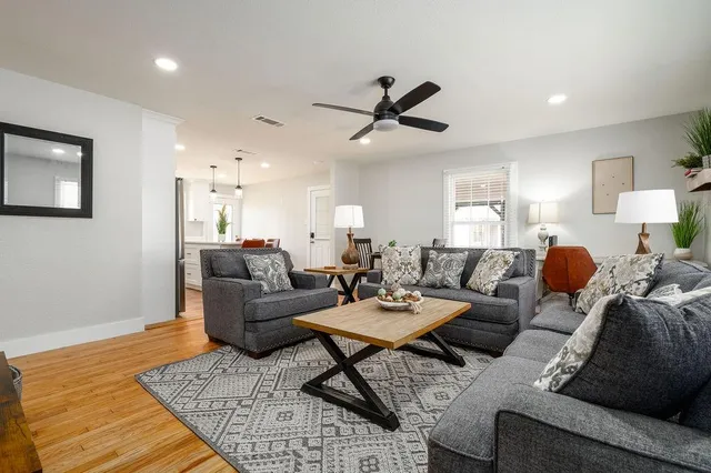 a living room with furniture and a rug