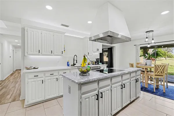 a kitchen with stainless steel appliances granite countertop a sink and a cabinets
