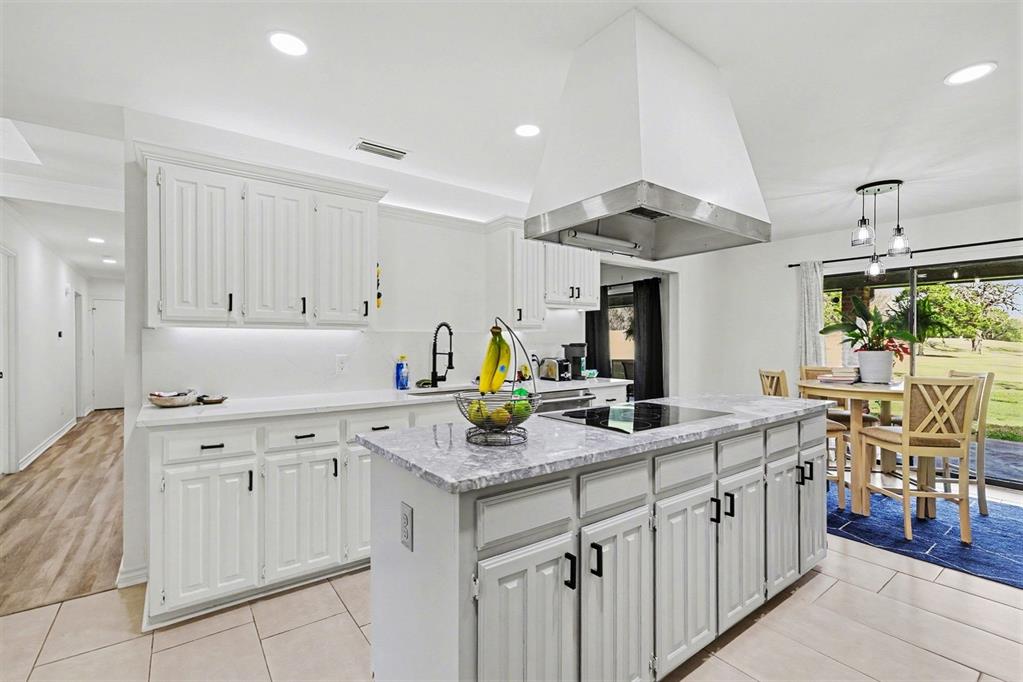 6746 Talbot Parkway Dallas, TX 75232 - Photo 11 of 34 a kitchen with stainless steel appliances granite countertop a sink and a cabinets