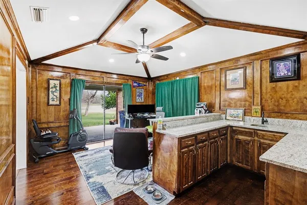 a open kitchen with stainless steel appliances granite countertop a stove and a sink