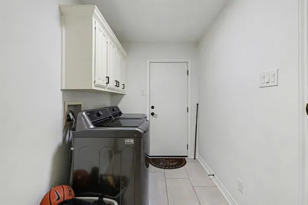 a view of storage and utility room with washer and dryer