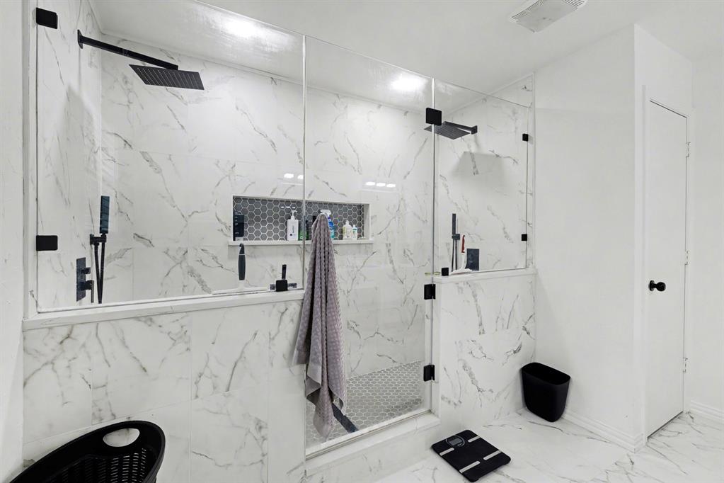 6746 Talbot Parkway Dallas, TX 75232 - Photo 24 of 34 a bathroom with a granite countertop sink a toilet and shower