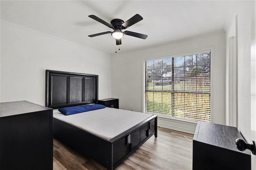 6746 Talbot Parkway Dallas, TX 75232 - Photo 26 of 34 a living room with a bed furniture and a window