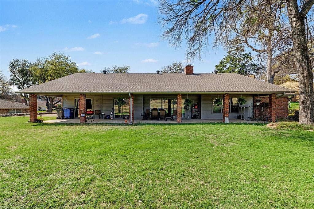 6746 Talbot Parkway Dallas, TX 75232 - Photo 30 of 34 a view of an house with backyard space and balcony