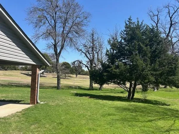 a view of a backyard with green space