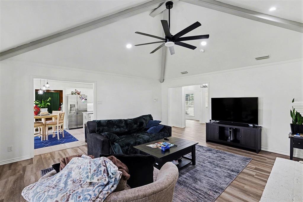 6746 Talbot Parkway Dallas, TX 75232 - Photo 8 of 34 a living room with furniture and a flat screen tv