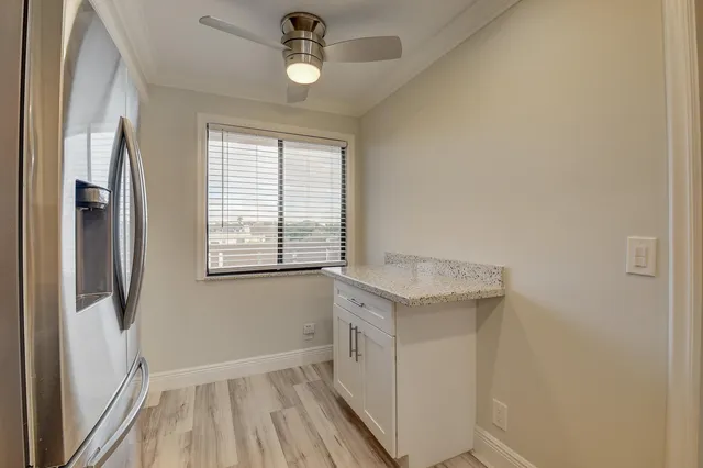 a spacious bedroom with a bed and window