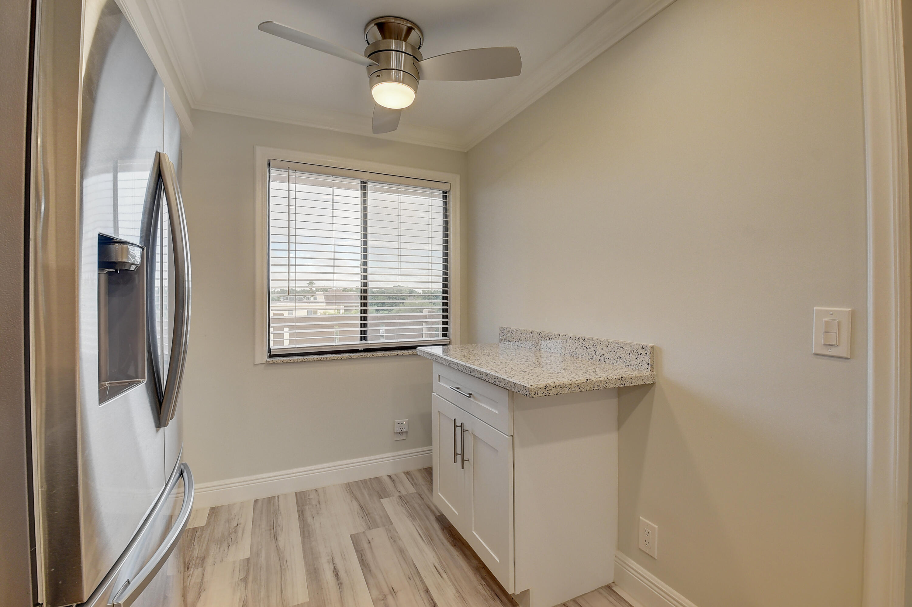 7076 Huntington Lane, Unit 507 Delray Beach, FL 33446 - Photo 15 of 48 a bathroom with a granite countertop sink and a window