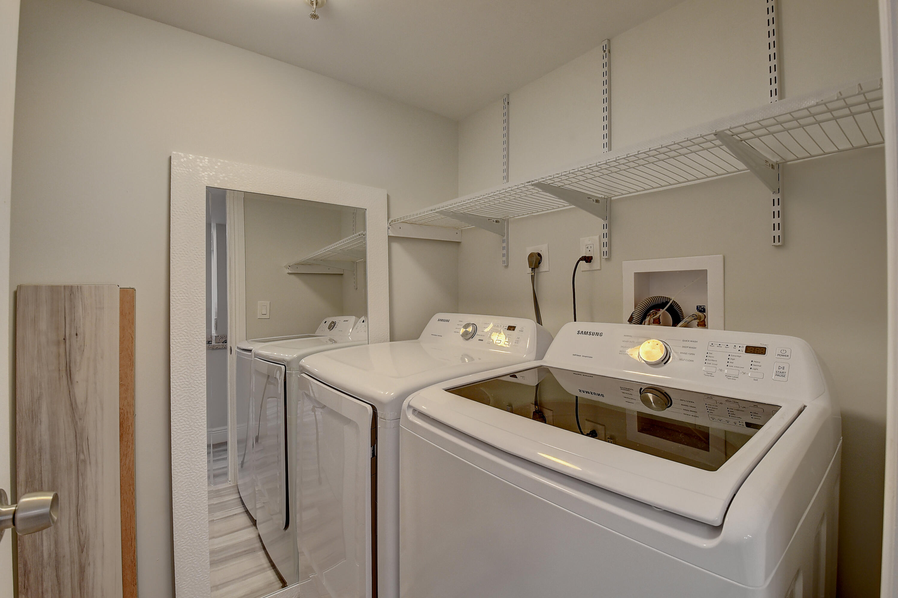 7076 Huntington Lane, Unit 507 Delray Beach, FL 33446 - Photo 23 of 48 a utility room with dryer and washer