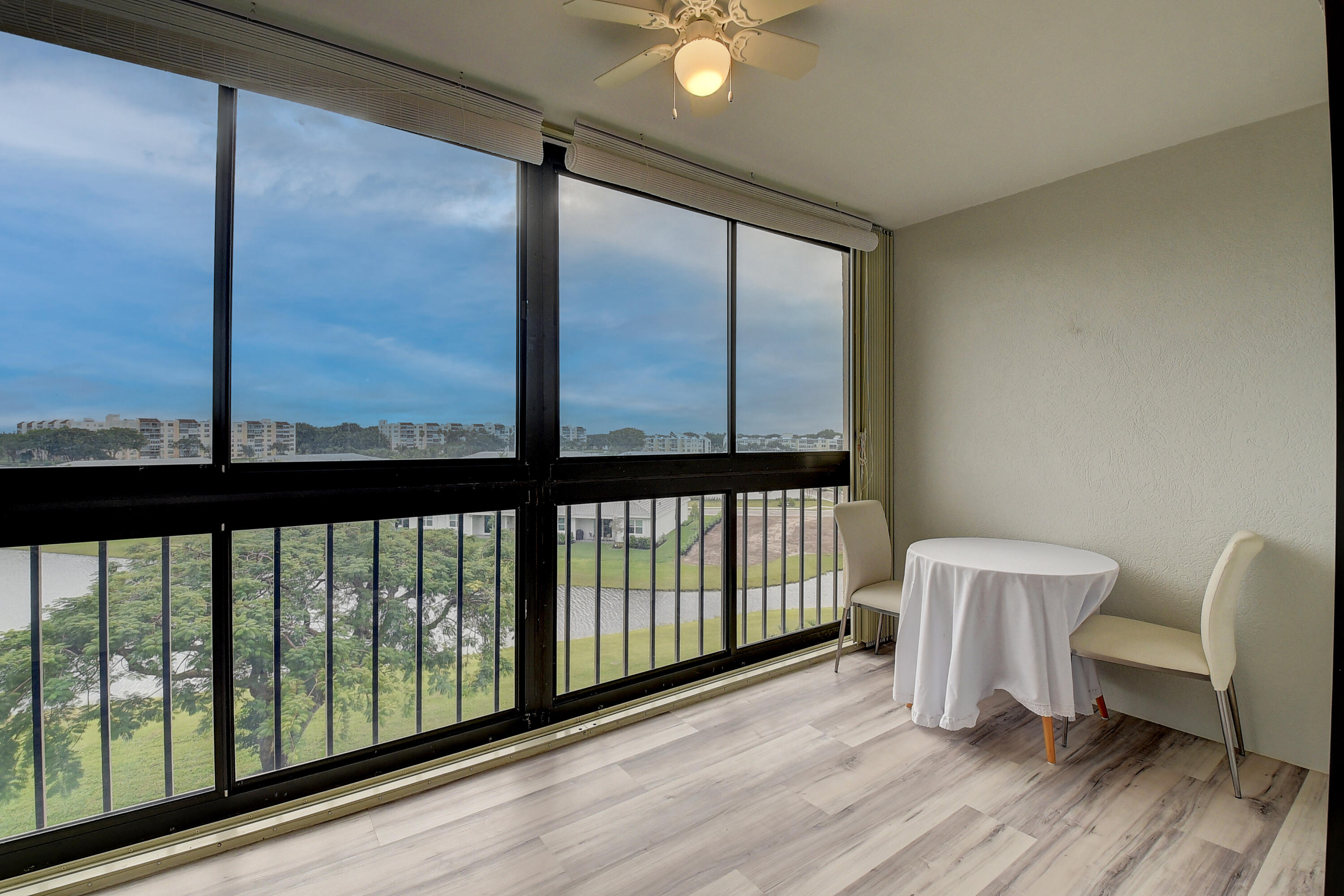 7076 Huntington Lane, Unit 507 Delray Beach, FL 33446 - Photo 24 of 48 a view of a porch with furniture and a window