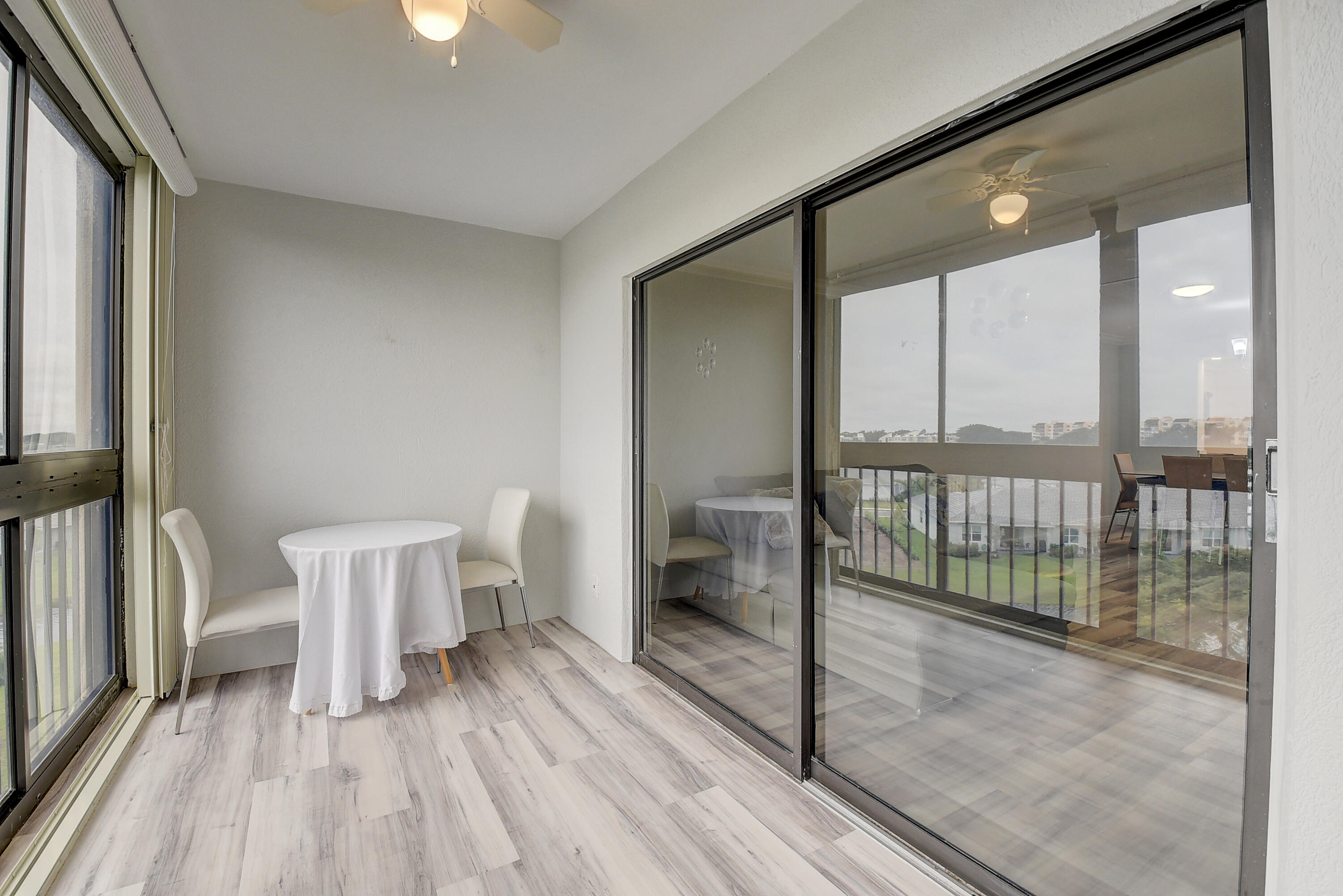 7076 Huntington Lane, Unit 507 Delray Beach, FL 33446 - Photo 26 of 48 a view of entryway with wooden floor
