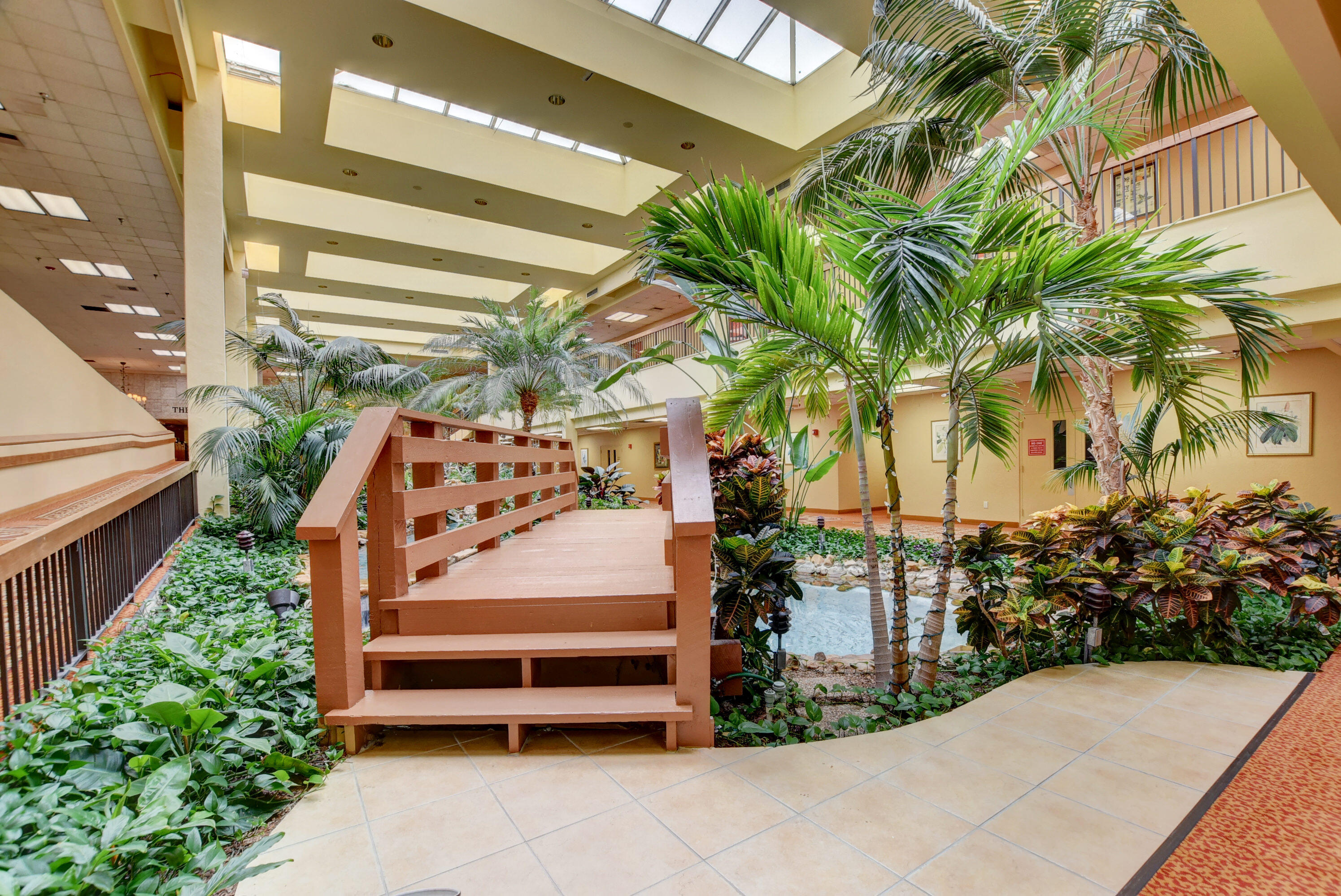 7076 Huntington Lane, Unit 507 Delray Beach, FL 33446 - Photo 36 of 48 a view of backyard with outdoor seating and plants