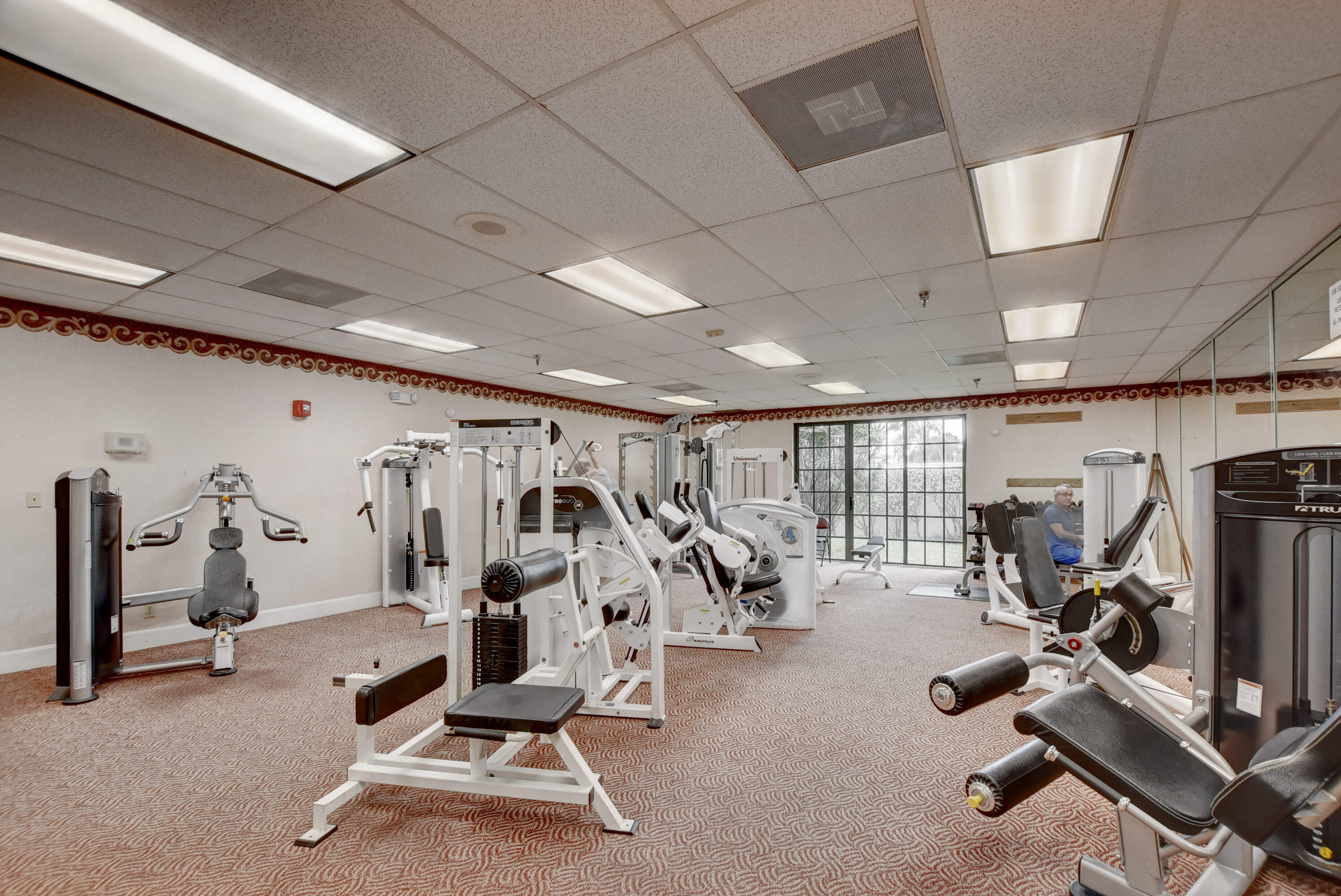 7076 Huntington Lane, Unit 507 Delray Beach, FL 33446 - Photo 37 of 48 a view of a room with gym equipment